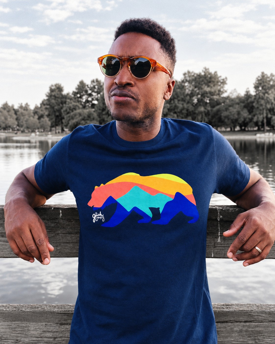 Navy bear tee portrait beside the lake