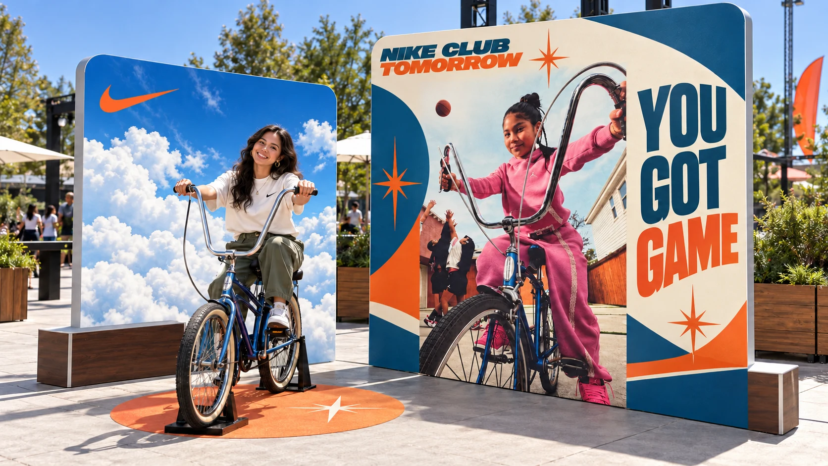 The stationary bicycle photo setup with a blue-sky backdrop and Nike campaign-inspired side panel