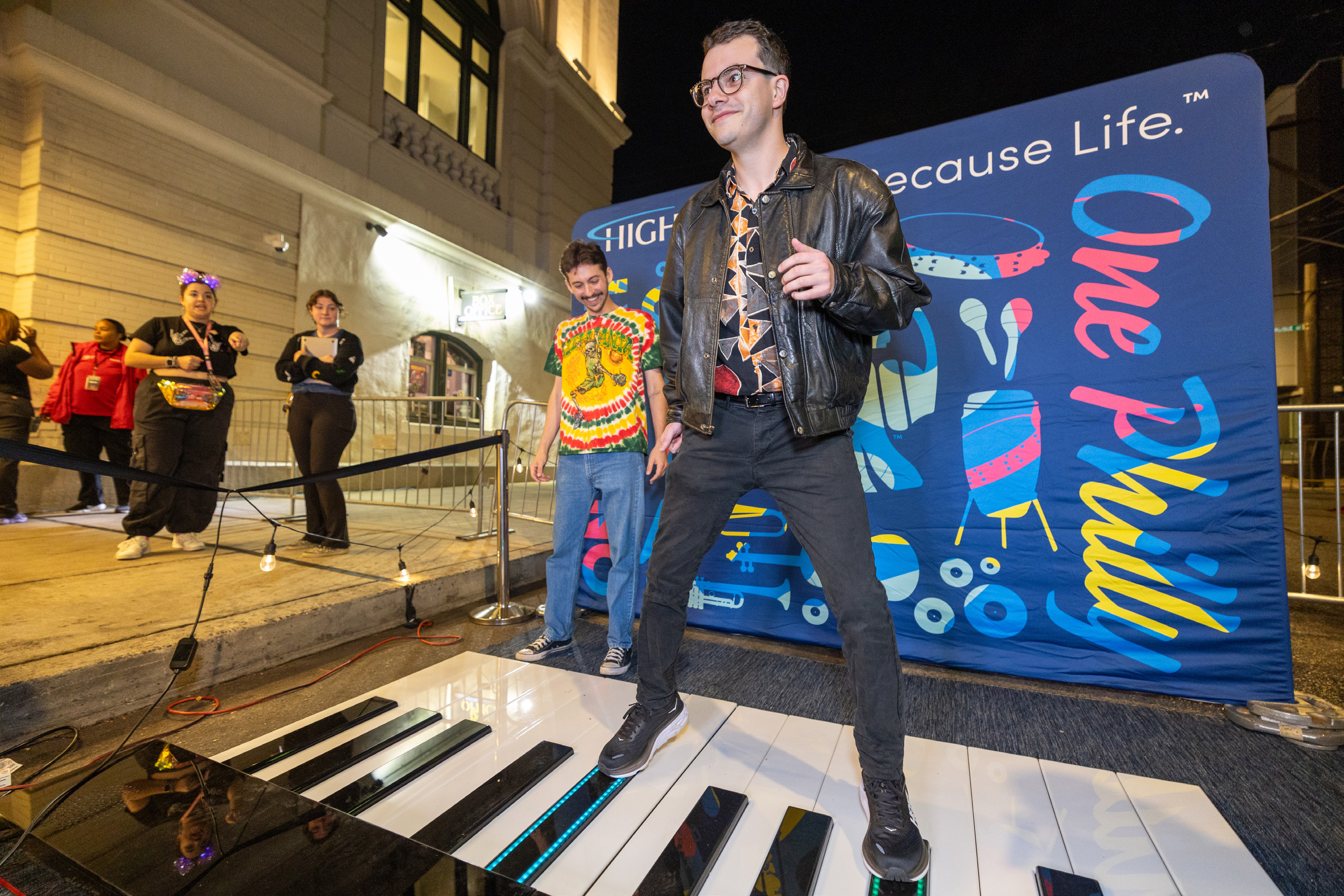 Guest playing the floor piano outside The Met